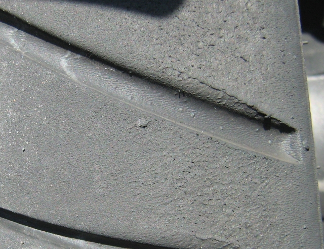 a maxxis rear tyre with boobling and ripping from high speed cornering